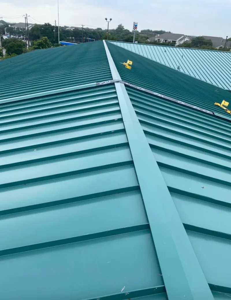 Green commercial metal roof ridge and valley for Metal Roof Repair in Summit